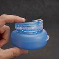 RESTIX Mouthguard Held in Hand with Case